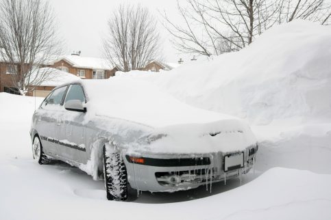 Car Parked in Snowy Driveway