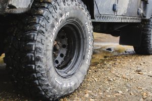 Close-up of car all-terrain tires on the mud road