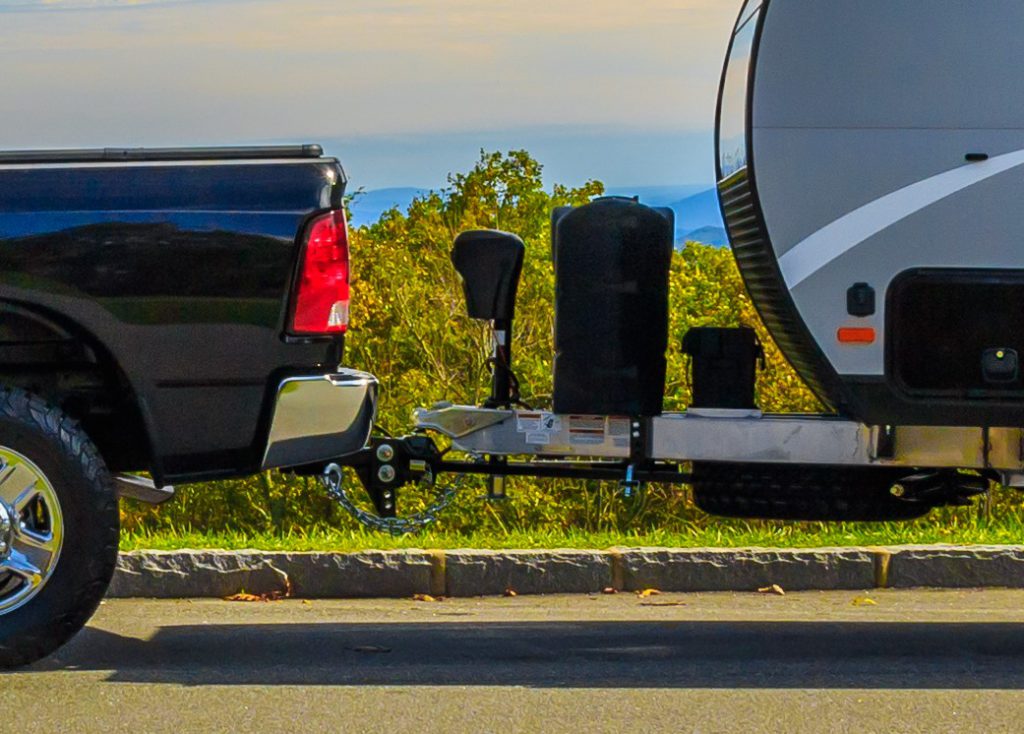 Jonas Ridge, NC, USA-16 October 17:  A Ram 2500 pickup towing a Camplite 16DBS travel trailer at an overlook on the Blue Ridge Parkway.