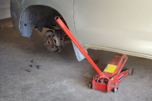 Car jack to lift car, changing car tire