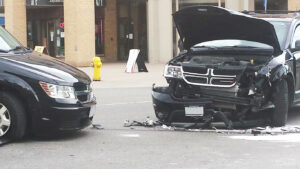 two destroyed vehicles accident in a crash in the middle of the street 