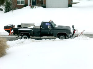 Straight Plow on a Truck Clearing the Street