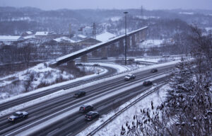 A busy road covered in snow during winter in Toronto.