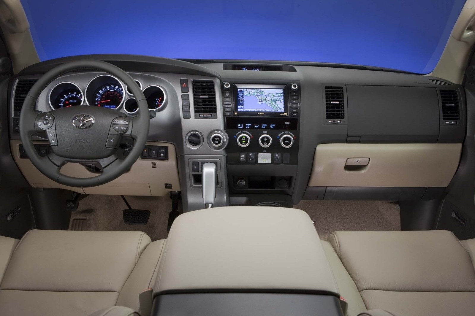 The front dash of the 2012 Toyota Sequoia, with a light interior.