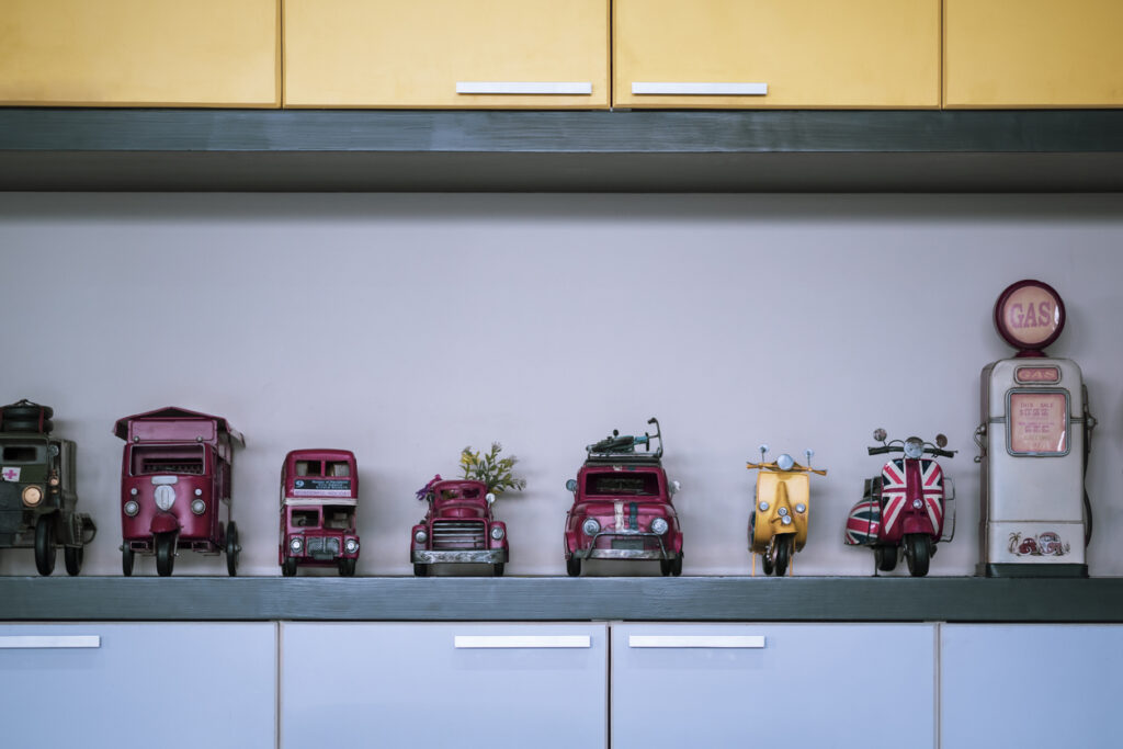 Row of miniature retro vehicle toys