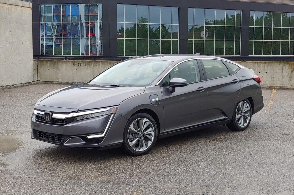 Grey Honda Clarity in front of a building