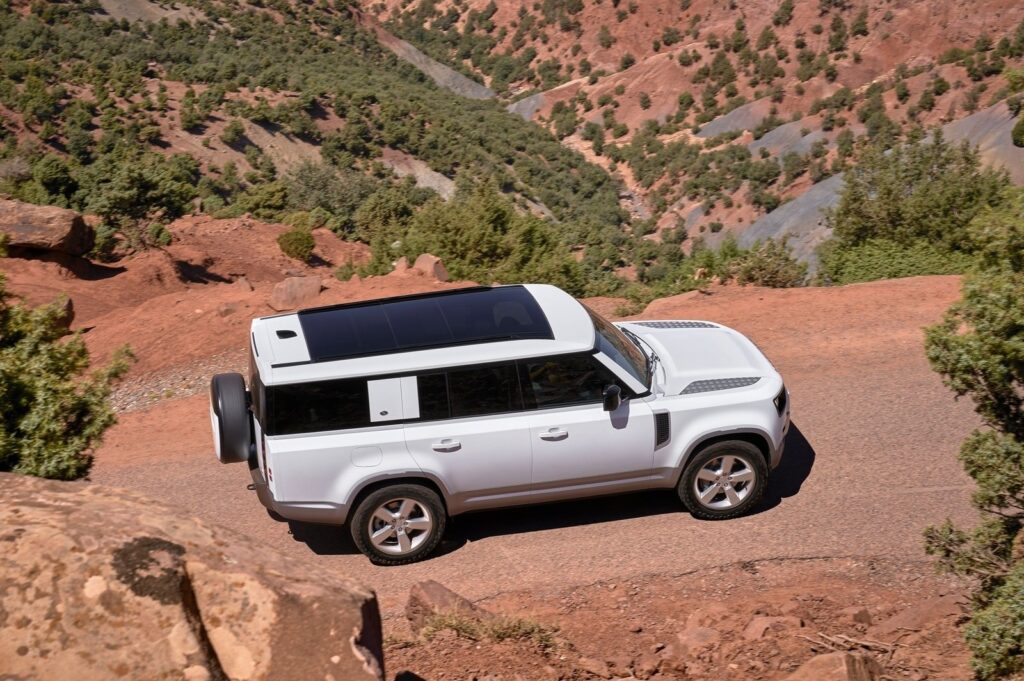 White 2023 Land Rover Defender 130 on the trail