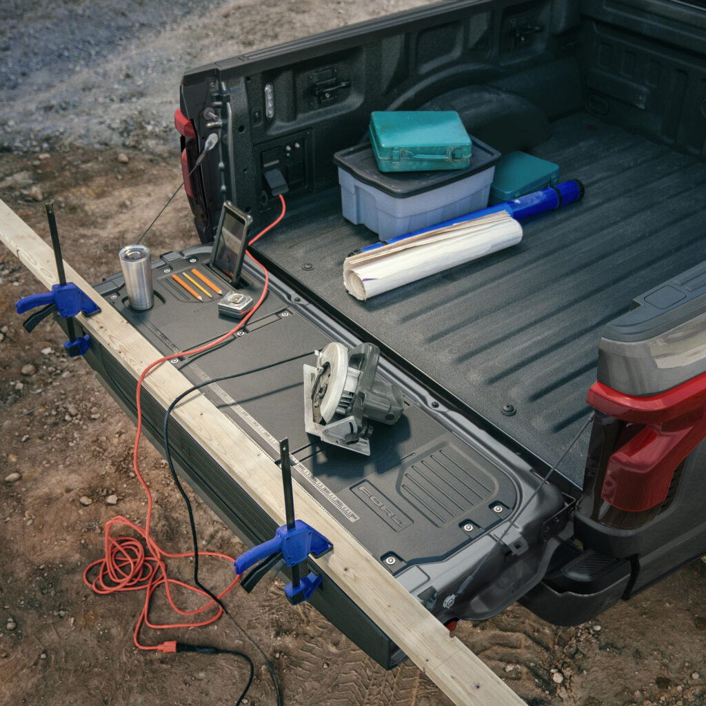 2022 Ford F-150 Lightning Pro Tailgate down with construction tools set up.